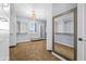 Large walk-in closet featuring a full-length mirror, storage shelves, a window, and carpeted floors at 3664 E Narrowleaf Dr, Gilbert, AZ 85298