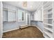 Bright walk-in closet with custom shelves, a window, and a bench at 3664 E Narrowleaf Dr, Gilbert, AZ 85298
