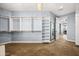 Spacious walk-in closet with custom storage shelves and rods, a mirror, and carpet at 3664 E Narrowleaf Dr, Gilbert, AZ 85298