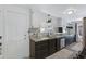Contemporary kitchen featuring modern countertops, tile floors, and stainless steel appliances at 4065 E University Dr # 332, Mesa, AZ 85205