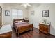 Well-lit bedroom with hardwood floors and vintage decor elements at 4117 E Molly Ln, Cave Creek, AZ 85331