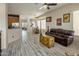 Spacious open-concept living room connecting kitchen and dining area, filled with natural light and decor at 4117 E Molly Ln, Cave Creek, AZ 85331