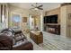 Spacious living room featuring tile floors, a fireplace, and sliding door access to the backyard at 4117 E Molly Ln, Cave Creek, AZ 85331