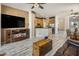 Open-concept living room with tile floors, a fireplace, and a view into the kitchen at 4117 E Molly Ln, Cave Creek, AZ 85331