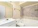 Clean bathroom with tile floors, a shower-tub combo, and a modern vanity at 4219 W Pasadena Ave, Phoenix, AZ 85019