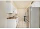 Functional kitchen with ample counter space, white cabinetry, and modern appliances at 4219 W Pasadena Ave, Phoenix, AZ 85019