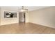 Bright and airy living room featuring neutral walls, tile flooring, and a ceiling fan at 4219 W Pasadena Ave, Phoenix, AZ 85019