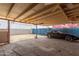 Covered patio featuring a black sports car with Gelato Guy banner at 4219 W Pasadena Ave, Phoenix, AZ 85019
