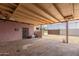 Covered patio with a small outdoor AC unit on the pink wall at 4219 W Pasadena Ave, Phoenix, AZ 85019