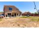 Backyard showing a covered patio, play area, and ample space for outdoor activities and entertaining at 4702 N 124Th Ave, Avondale, AZ 85392