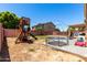 Backyard includes a play structure and trampoline, great for entertaining at 4702 N 124Th Ave, Avondale, AZ 85392