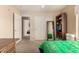 Neutral bedroom showcasing a large built-in bookshelf and double door closet at 4702 N 124Th Ave, Avondale, AZ 85392