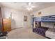 Bedroom featuring a bunk bed, dresser and closet for optimal storage at 4702 N 124Th Ave, Avondale, AZ 85392