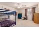 bedroom featuring a bunk bed, dresser and window for natural light at 4702 N 124Th Ave, Avondale, AZ 85392