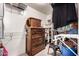 Walk-in closet with wooden dresser, shelving, and storage solutions for optimized organization at 4702 N 124Th Ave, Avondale, AZ 85392