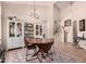 Open dining area with a table, chairs, and a bright chandelier at 4702 N 124Th Ave, Avondale, AZ 85392