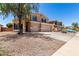 Two-story home with three car garage and desert landscaping at 4702 N 124Th Ave, Avondale, AZ 85392