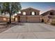 Beautiful two-story home with a three-car garage and well-manicured landscaping at 4702 N 124Th Ave, Avondale, AZ 85392