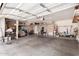 Spacious garage featuring ample storage space and an open layout, ideal for vehicles and organization at 4702 N 124Th Ave, Avondale, AZ 85392