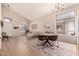 Bright living room with hardwood floors, a cozy sofa, and vaulted ceilings at 4702 N 124Th Ave, Avondale, AZ 85392