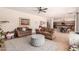 Spacious living room with hardwood floors adjacent to the kitchen area at 4702 N 124Th Ave, Avondale, AZ 85392