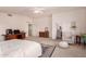 Neutral main bedroom with a ceiling fan, en suite access, and plenty of space for furniture at 4702 N 124Th Ave, Avondale, AZ 85392
