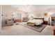Bright main bedroom features neutral tones, a ceiling fan, and ample natural light at 4702 N 124Th Ave, Avondale, AZ 85392