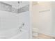 Clean white shower and tub with a mosaic tile accent stripe at 4808 N 24Th St # 230, Phoenix, AZ 85016