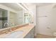 Bright bathroom featuring a double vanity, contemporary lighting, and modern fixtures at 4808 N 24Th St # 230, Phoenix, AZ 85016
