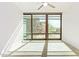 Bright bedroom with a ceiling fan and expansive windows allowing lots of sunlight at 4808 N 24Th St # 230, Phoenix, AZ 85016