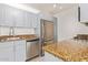 Well-lit kitchen with stainless steel appliances and granite countertops at 4808 N 24Th St # 230, Phoenix, AZ 85016