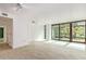 Bright living room with floor-to-ceiling windows and wood-style tile flooring at 4808 N 24Th St # 230, Phoenix, AZ 85016