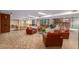 Comfortable lobby seating area with tables and access to adjacent buildings at 4808 N 24Th St # 230, Phoenix, AZ 85016