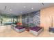 Modern lobby with bold accent wall, seating, and glass doors to the exterior at 4808 N 24Th St # 230, Phoenix, AZ 85016