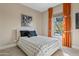 Comfortable bedroom with vibrant curtains, cozy bedding, and natural light for a cheerful living space at 5420 E Duane Ln, Cave Creek, AZ 85331