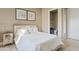 Cozy bedroom with comfortable bedding, modern art, and access to an en-suite bathroom for added convenience at 5420 E Duane Ln, Cave Creek, AZ 85331