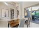 Bright, open dining area with views to the outdoors, tall ceilings, and stylish pendant lighting at 5420 E Duane Ln, Cave Creek, AZ 85331