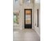 Bright entryway with decorative front door, tiled floors, and a sunlit window at 5420 E Duane Ln, Cave Creek, AZ 85331