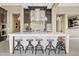 Elegant kitchen with a large island, stylish seating, and modern stainless steel appliances at 5420 E Duane Ln, Cave Creek, AZ 85331