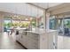 Kitchen island featuring sink, stainless steel appliances, and a view of the outdoor entertaining space at 5420 E Duane Ln, Cave Creek, AZ 85331