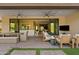 Covered patio with ample seating, outdoor dining, and sliding glass doors to the home at 5420 E Duane Ln, Cave Creek, AZ 85331