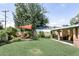Spacious backyard featuring well-maintained lawn, a fire pit, and patio seating at 5808 N 18Th Pl, Phoenix, AZ 85016