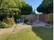 Backyard featuring a pond, fire pit and stone pathway, complete with mature trees at 5808 N 18Th Pl, Phoenix, AZ 85016