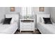 Charming bedroom with two twin beds, white furniture, and neutral decor at 5808 N 18Th Pl, Phoenix, AZ 85016