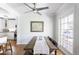 Dining room with long wooden table, chandelier, and access to kitchen at 5808 N 18Th Pl, Phoenix, AZ 85016