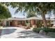 Attractive brick home featuring a well-maintained yard and a covered carport at 5808 N 18Th Pl, Phoenix, AZ 85016