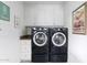 Laundry room with front load washer and dryer, cabinetry, and neutral decor at 5808 N 18Th Pl, Phoenix, AZ 85016