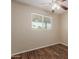 This empty bedroom features a wood ceiling fan, window, and wood-look flooring at 6126 N 31St Dr, Phoenix, AZ 85017