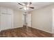 This empty bedroom features a wood ceiling fan, an attached closet, and wood-look flooring at 6126 N 31St Dr, Phoenix, AZ 85017