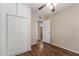 This empty bedroom features a closet, wood ceiling fan, and wood-look flooring at 6126 N 31St Dr, Phoenix, AZ 85017